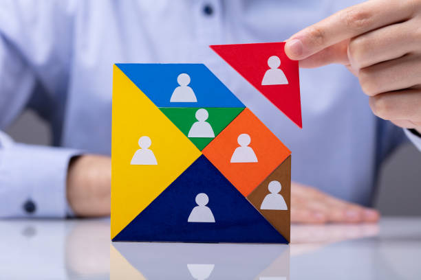 istock Businessman Building Tangram Square Block 1146965412
