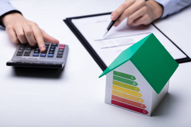 istock Small House With Energy Efficiency Rate On White Desk 1146965465