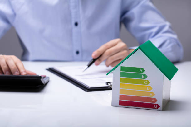 istock Small House With Energy Efficiency Rate On White Desk 1146965467