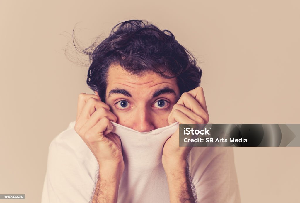 Young Man Feeling Frightened And Shocked Making Scared Gestures In Fear And  Anxiety Terrified And Desperate Trying To Cover Himself Copy Space People  Human Expressions And Emotional Reactions Stock Photo - Download