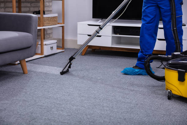 istock Male Janitor Cleaning Carpet 1146967782