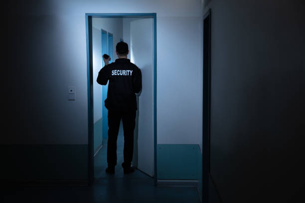 istock Security Guard Standing In Corridor Of Building 1146967854