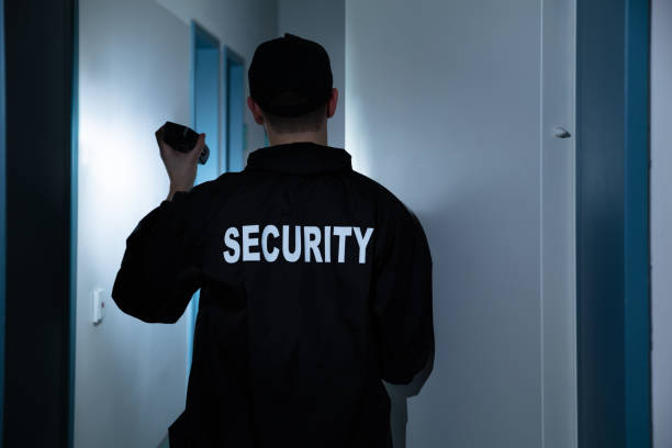 istock Security Guard Standing In Corridor Of Building 1146967856