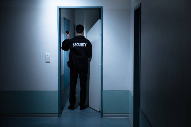 istock Security Guard Standing In Corridor Of Building 1146967862