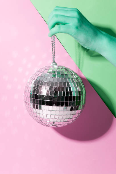istock Shiny disco ball on a bright pastel creative background. Pop disco music style attributes eighties 1146969555