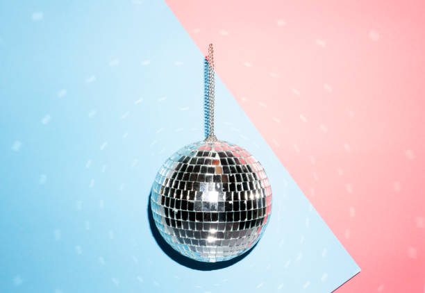 istock Shiny disco ball on a bright pastel creative background. Pop disco music style attributes eighties 1146969561