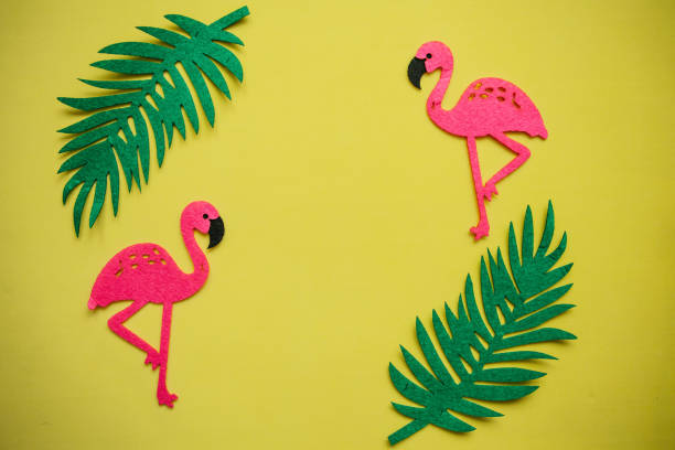 istock Flamingo and leaves on a yellow background. Summer design. 1146969682