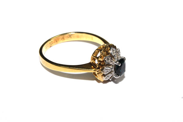 istock Expensive Finger Ring Gold and Jewels On White Background 1146970775