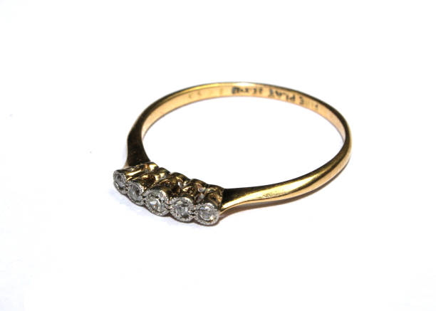 istock Expensive Finger Ring Gold and Jewels On White Background 1146970795