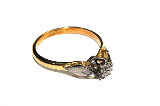 istock Expensive Finger Ring Gold and Jewels On White Background 1146970830