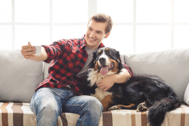 istock Young person with dog at home leisure 1146971769