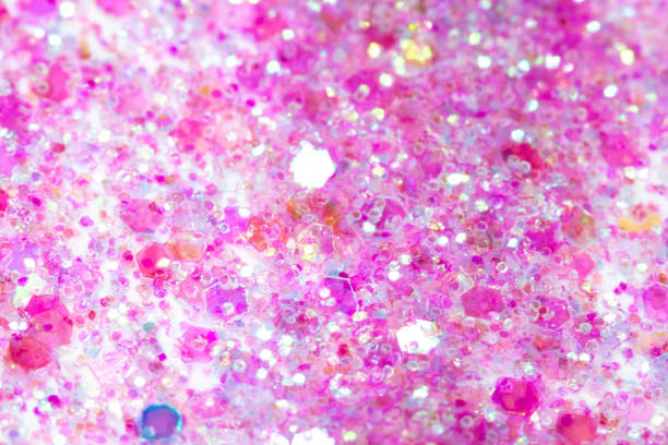 istock Pink Sparkling Glitter on White Background Bokeh Abstract Close Up 1146972330