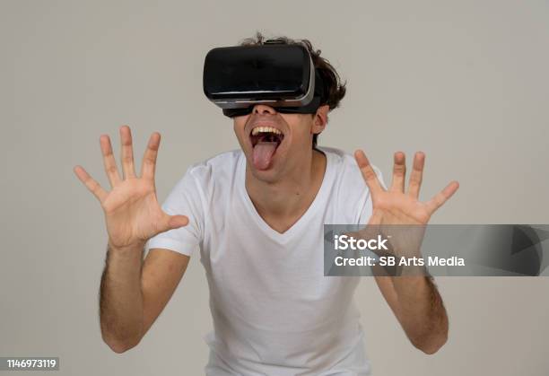Amazed Funny Man Using Vr Headset Glasses Touching And Interacting With  Virtual Reality World Feeling Excited