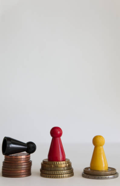 istock Coins stacks with figure yellow red black 1146978717