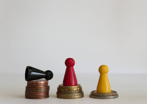 istock Coins stacks with figure yellow red black 1146978771