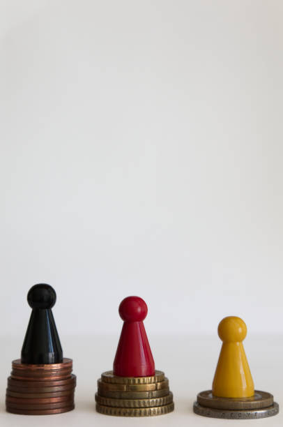 istock Coins stacks with figure yellow red black 1146978772
