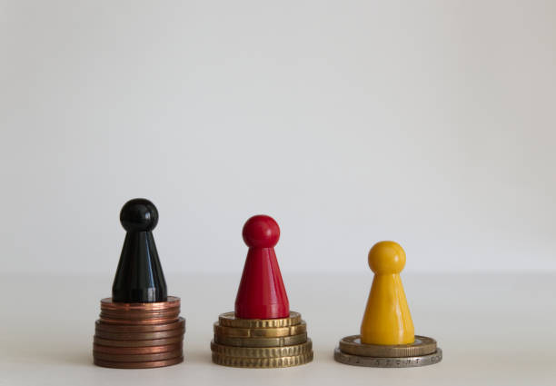 istock Coins stacks with figure yellow red black 1146978820