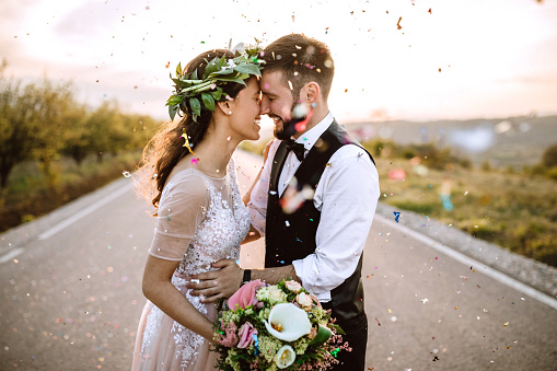 Wedding couple in love, confetti