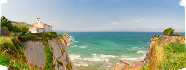 panorama of Itzurun beach and hills of Zumaia coast at summer, Pais Vasco