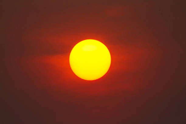 Bright big sun on the sky with yellow orange gradient colors. Picture Close Up The sun is used as a background for graphic work.