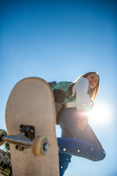 istock Smiling Young Girl With Skateboard 1146994537