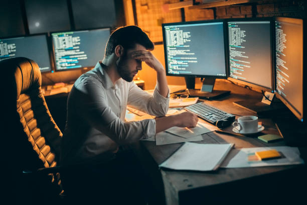 istock Young male trader at office work concept sitting tired 1146995452