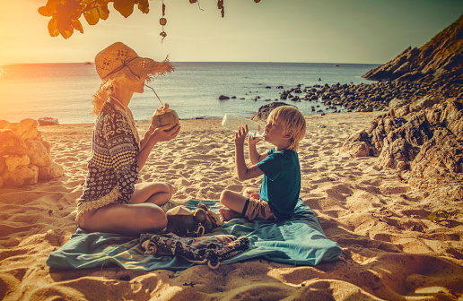 Family picnic on tropical beach