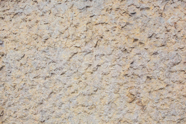 istock texture, background: old concrete wall with peeling plaster crumbling whitewash 1146997508