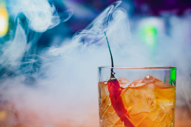 istock Red cocktail with bell pepper in martini glass 1147000096