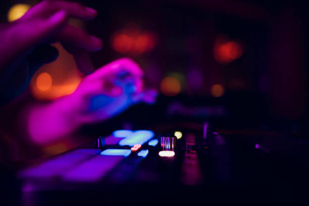 istock DJ playing music mixer closeup 1147000353