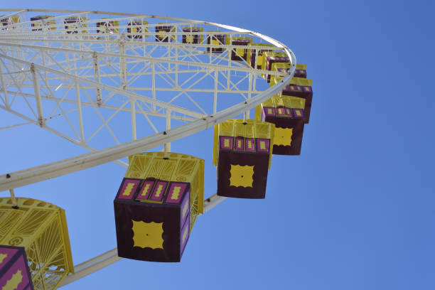istock Giant Ferris Wheel against blue sky 1147002474
