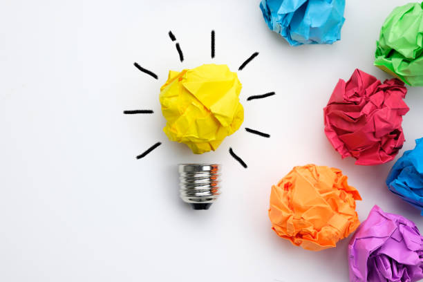 Great idea concept with crumpled colorful paper and light bulb stock photo