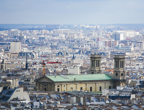 Aerial view on the center of Paris as seen from Montmartre, with the Church of St Vincent de Paul,  in the 10th arrondissement of Paris.