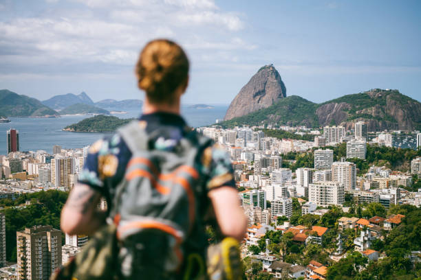Rear view of backpacker looking at Sugarloaf Mountain