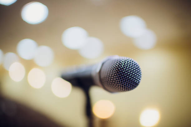 istock microphone on stand up comedy stage with reflectors ray, high contrast image 1147007698
