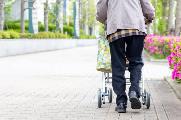 istock Elderly person with walking auxiliary instrument. 1147007937