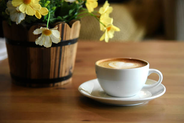 istock a cup of coffee on wooden table 1147010208