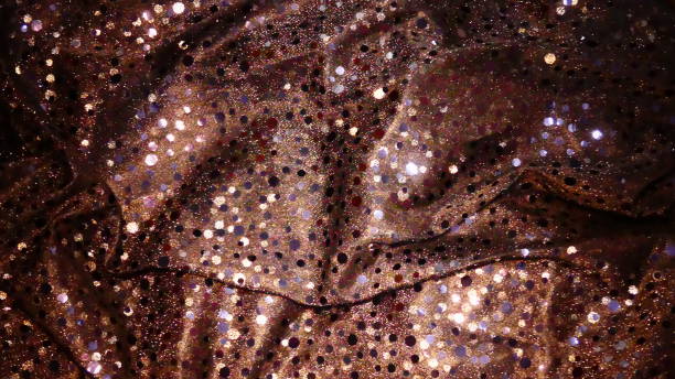 istock Shiny fabrics with sequins in bronze shades 1147011177