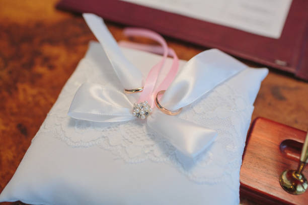 istock wedding rings on a cushion 1147012169