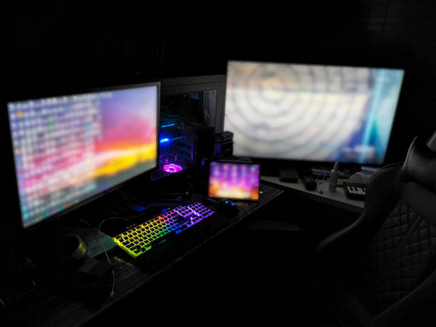 istock battle station gaming rig with multiple monitors for gamers coders miners designers renderers in a dark room with rgb lights on 1147016942