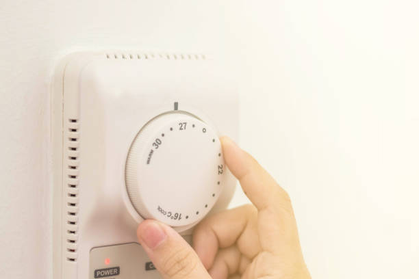 istock Energy saving concept. Air conditioner A/C Controller with turn to 27 degree celcius for save power. 1147020482