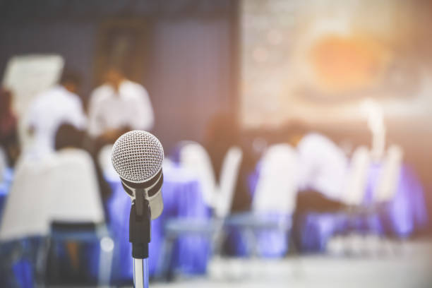 istock microphone wireless old on a stand in interior meeting room seminar empty conference background 1147021441