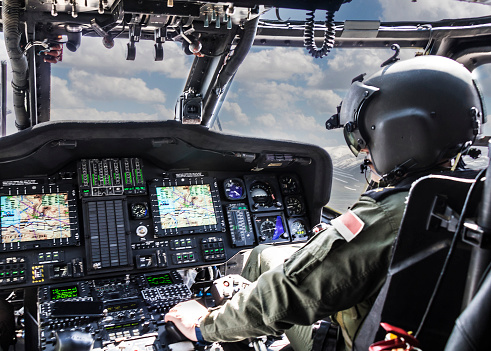 A closeup of Polish Army helicopter Mi-8 during training flights in a cloudy sky