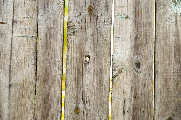 istock Wooden surface texture with bullet holes 1147022653