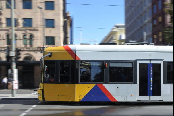 Adelaide, Australia - March 29 2019: Adelaide city tram in blurry motion. Adelaide Metro provides a free tram service in Adelaide the capital city of South Australia.