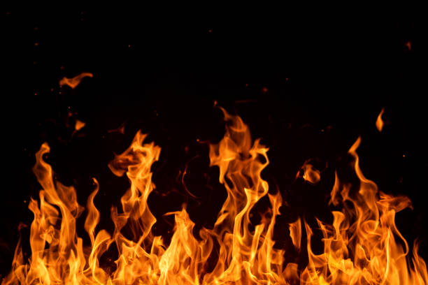 istock Blazing fire flames isolated on black 1147029004