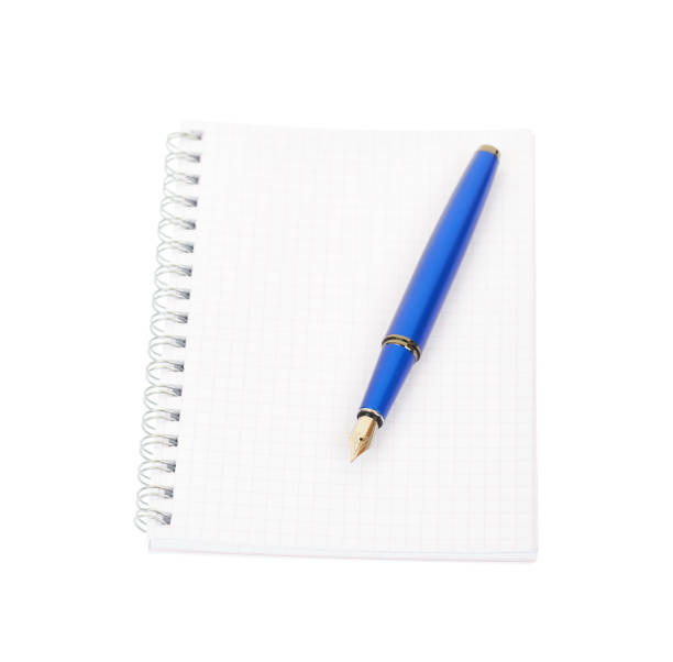 istock Fountain pen and spiral notebook isolated on white background. 1147029374