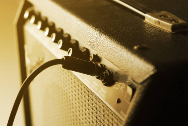 istock guitar amplifier with cable audio jack, warm tone 1147038394