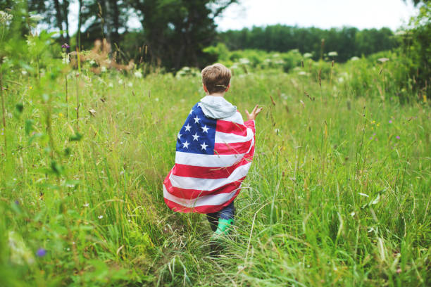 istock Chid with American flag outdoors 1147038686