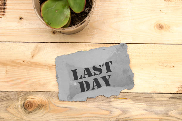istock last day on grey cardboard on wooden table 1147041892